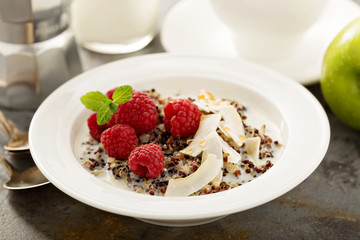 Quinoa porridge with raspberry and coconut flakes