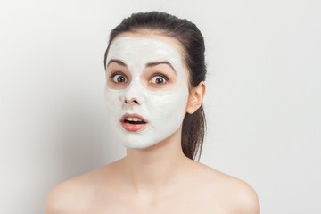 white mask and surprised woman