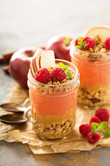 Applesauce and raspberry puree parfait with granola