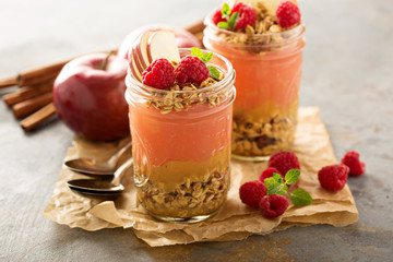 Applesauce and raspberry puree parfait with granola