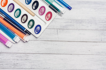 Fototapeta premium Multicolored markers and dots near watercolor paints