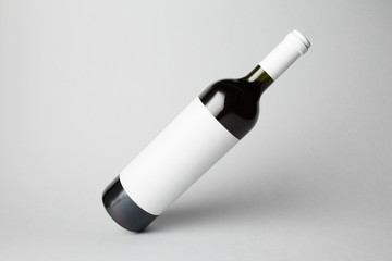 Slanted bottle on gray background