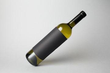 Slanted bottle on gray background