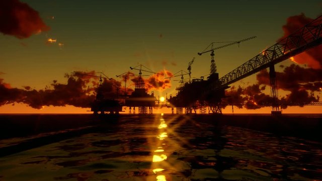 Oil Rig in Ocean at sunset