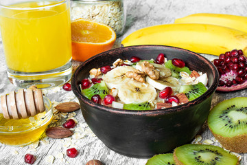 fruit oatmeal porridge with orange juice for healthy breakfast