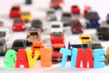Toy cars with colourful letters sign SAVE TIME