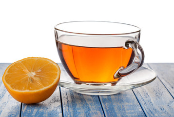glass cup of tea on a wooden background