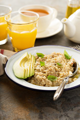 Savory oatmeal porridge with olive oil and avocado