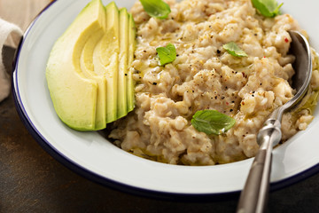 Savory oatmeal porridge with olive oil and avocado