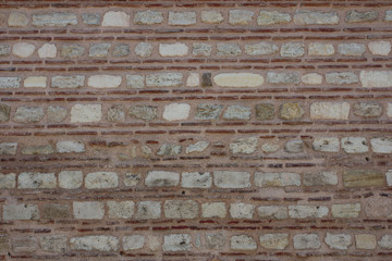 Old stone wall with brick texture background.