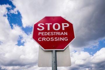 Stop Sign with Cloudy Sky
