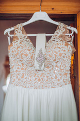 beautiful bride standing at the dress and mirror. morning bride.