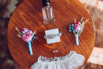 Bride's morning. Wedding accessories on wooden background.
