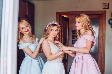 nice portrait of beautiful bride and her charming bridesmaids