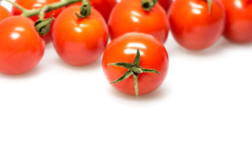 reshly picked cherry tomatoes on a branch