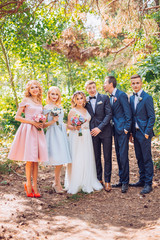 beautiful newlyweds with their friends having fun together. Friendship picture. All time together. Bridesmaids and groomsman with bride and groom.