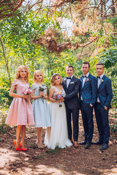 beautiful newlyweds with their friends having fun together. Friendship picture. All time together. Bridesmaids and groomsman with bride and groom.
