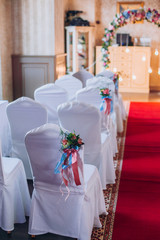 Table set for wedding or another catered event dinner. Decoration arch flowers gift box.