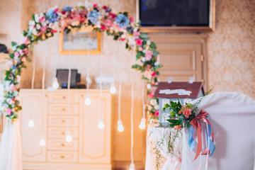 Table set for wedding or another catered event dinner. Decoration arch flowers gift box.