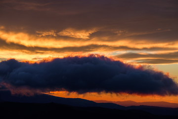 Layers of clouds, dyed in different shades