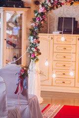 Table set for wedding or another catered event dinner. Decoration arch flowers gift box.