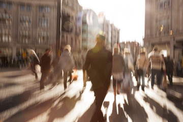 People walking under the sun, zoom effect, motion blur