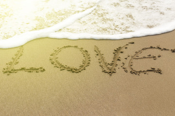 Heart love drawn on sand