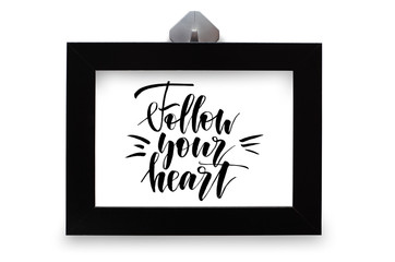 Follow your heart. Handwritten text. Modern calligraphy. Black photo frame