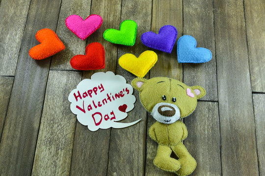 Teddy Bear and colourful hearts and words «Happy Valentines Day