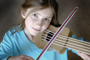 Little Young Girl Playing Homemade Toy Violyn