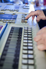 Young man in the process of offset printing and color correction