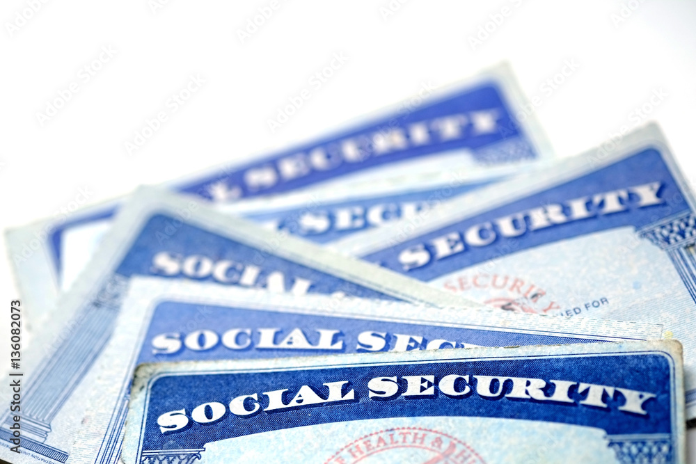 Wall mural Social Security Cards in a Row Pile for Retirement