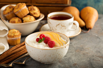 Rice pudding with raspberries and pears for breakfast