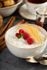 Rice pudding with raspberries and pears for breakfast