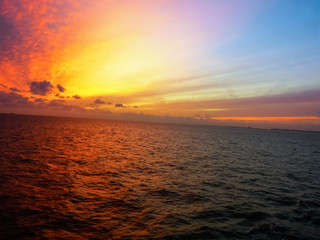 Colorful sky at sunrise above the ocean horizon