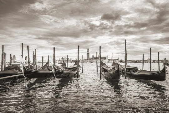 Gondolas in lagoon of Venice and San Giorgio island in background, Italy, Europe, Sepia filtered style