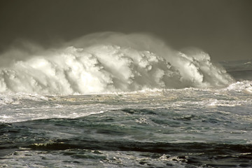 giant waves in storm day breaking in atlantic ocean