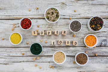 Superfood and healthy food on wooden background. Organic food.