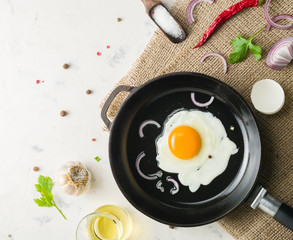 Morning in the kitchen. Cooking breakfast. Fried egg.