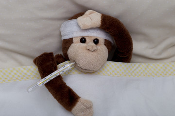 a toy monkey is sick