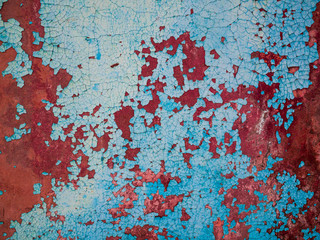 texture of rusty metal with an old peeling blue paint