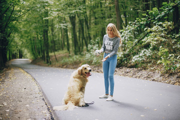 couple walking outdoors with her dog