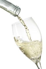 bottle pouring white wine in a glass