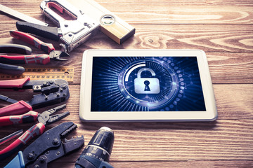 Web security and technology concept with tablet pc on wooden tab © adam121