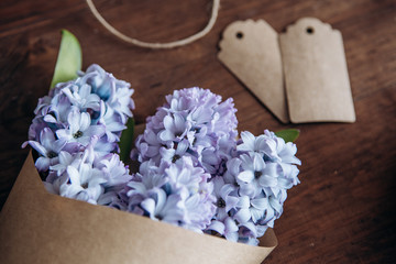 Flowers composition. Bouquet Hyacinths on a wood table. Valentine's Day. Flat lay, top view.