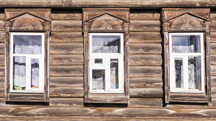 Fototapeta na wymiar facade of an old Russian house with frames
