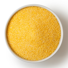 Cornmeal polenta in white ceramic bowl isolated on white.