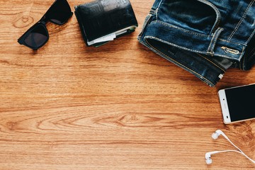 Men's accessories on wooden table.