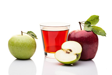 red and green apples. glass of juice. isolated on white