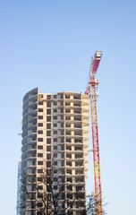 Construction of an apartment building. Crane